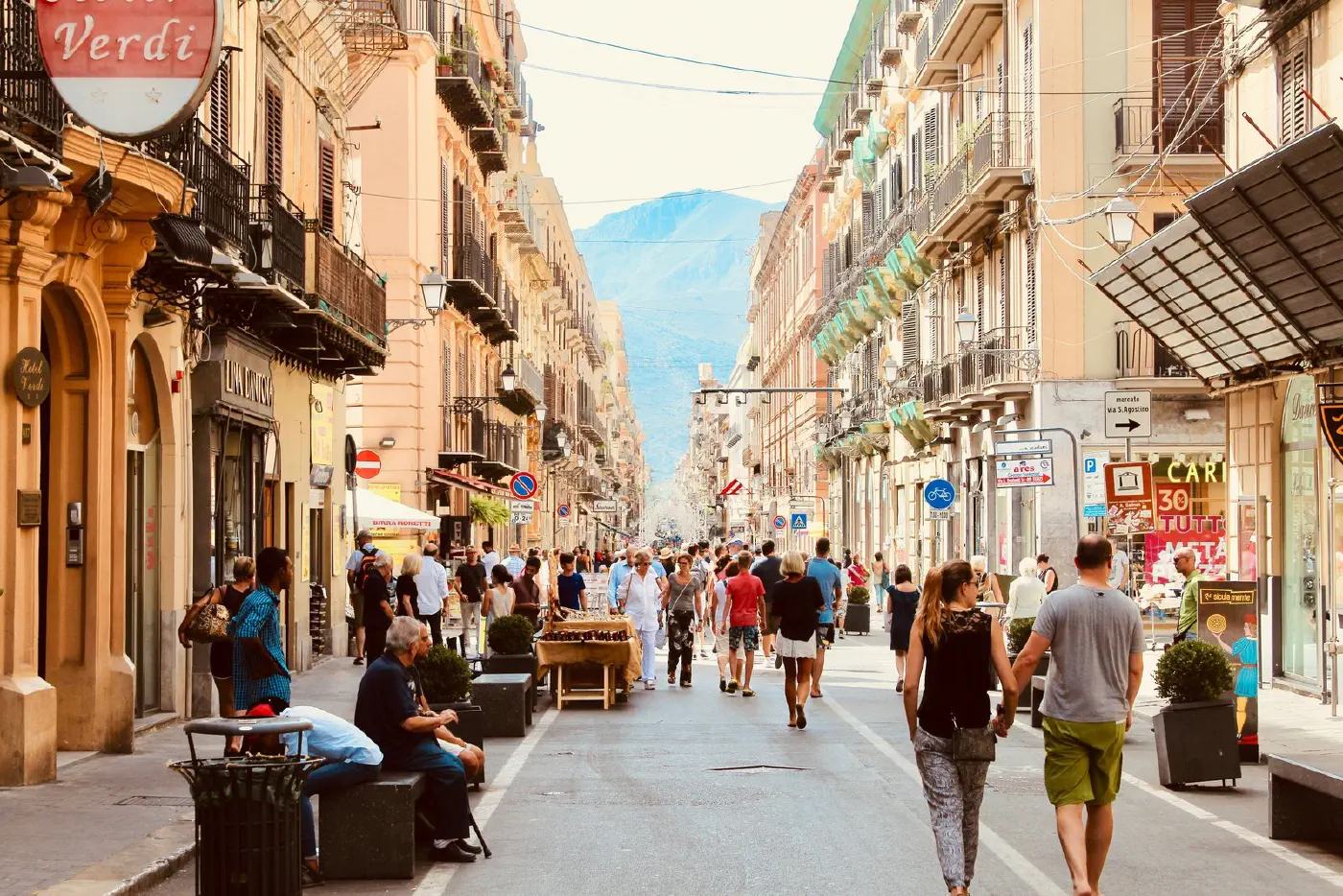 A busy European high street lined with shops and pedestrians, the kind of real, trading location the embedding ranks as a look-alike.